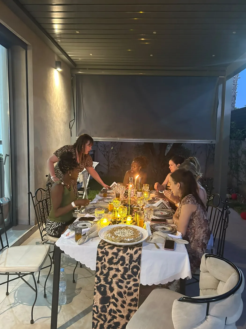 Guests enjoying a candlelit private dinner at a Marrakech villa